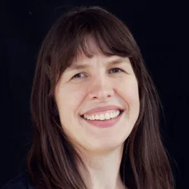 Profilbilde av Monica Tjelmeland, smilende.