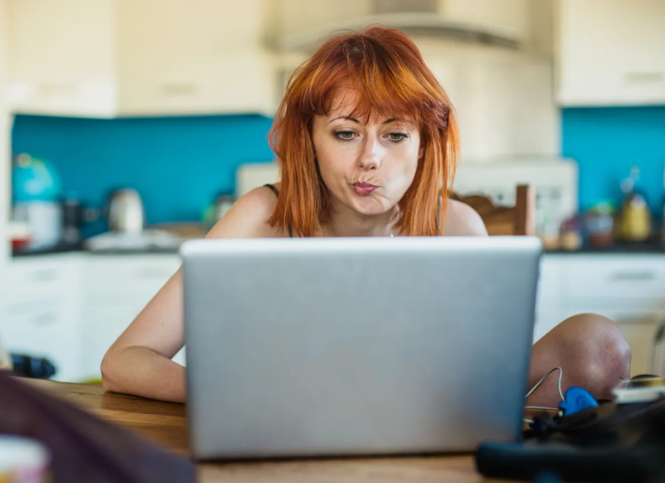 Woman looking intensly at laptop